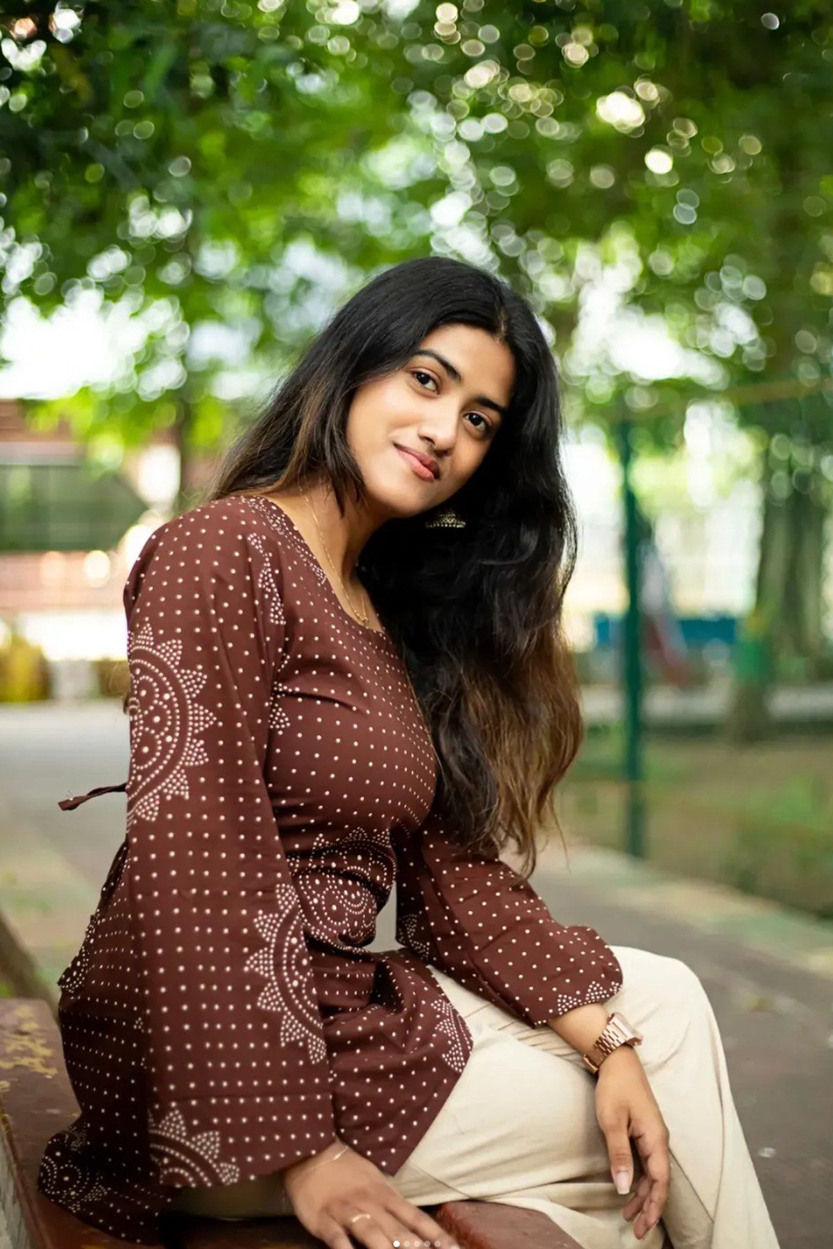 Cocoa brown bandhani-print top, close view of the sleeve medallions