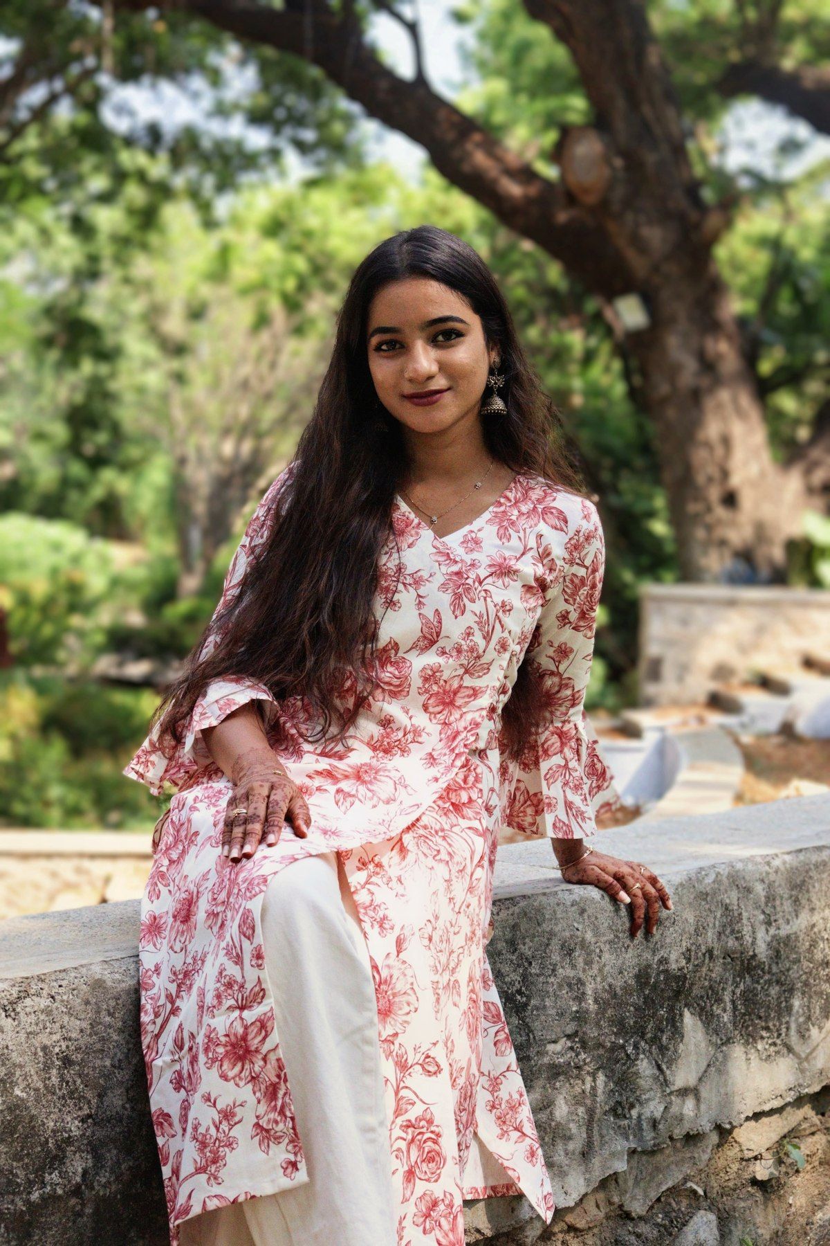 Rose garden wrap top in red on ivory, worn with white palazzo