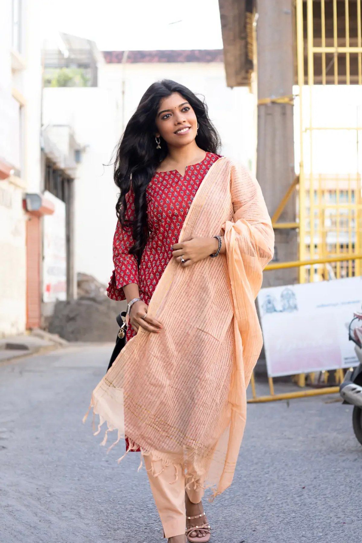 Full-length view of the scarlet buti kurta with dupatta and matching pants